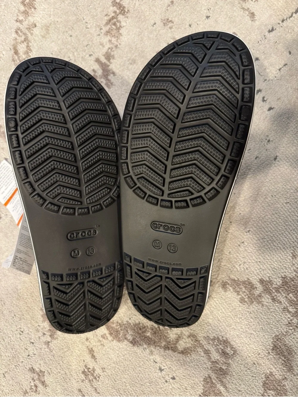 CROCS Black Slide Sandals with White Accent Stripe